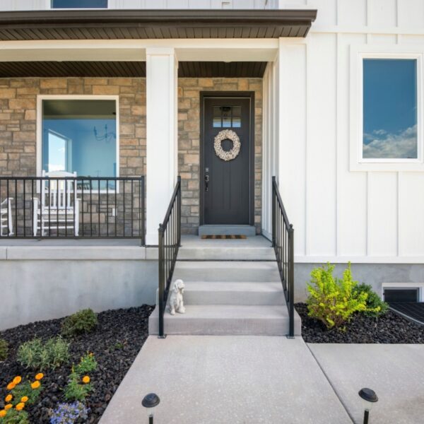 Stone veneer siding on a newly constructed home, along with vinyl siding